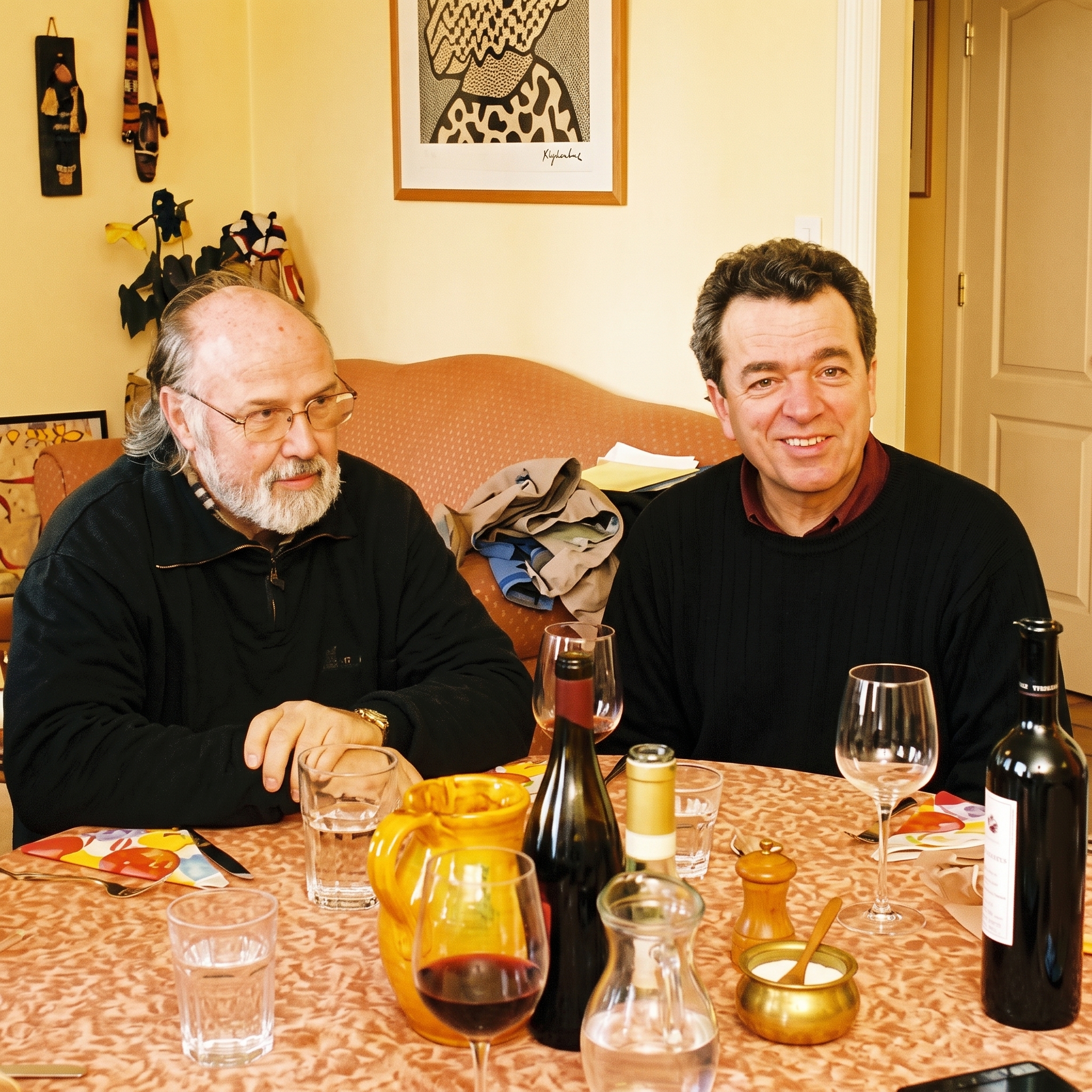 Marco Mugelli and Giorgio Mori discussing milling engineering at a table, marking the beginning of their collaboration in Italy.